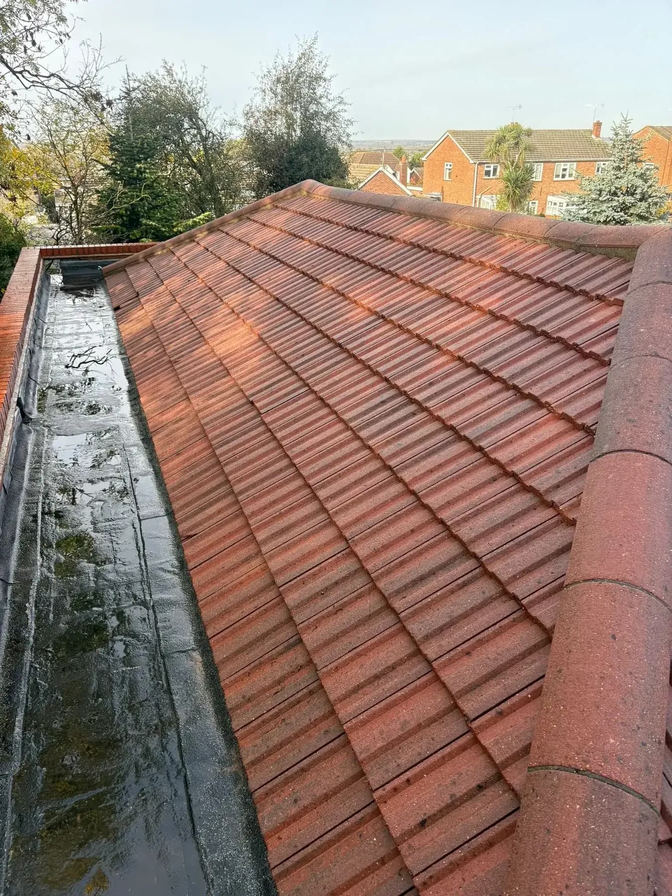 The same valley and gutter after cleaning, moss gone